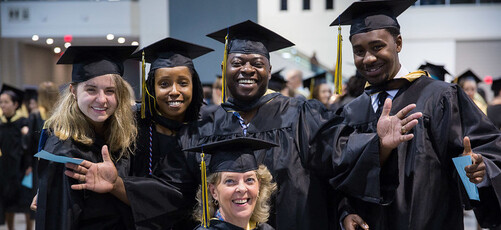 A group of happy students at a college graduation ceremony