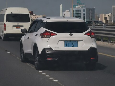 A white car on a freeway