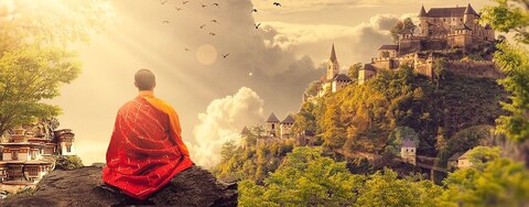 A person in red with a towel wrapped around their waist is sitting on a rocky outcrop, overlooking a beautiful landscape. The scene includes a small town, houses, and a church, as well as several birds flying in the sky.