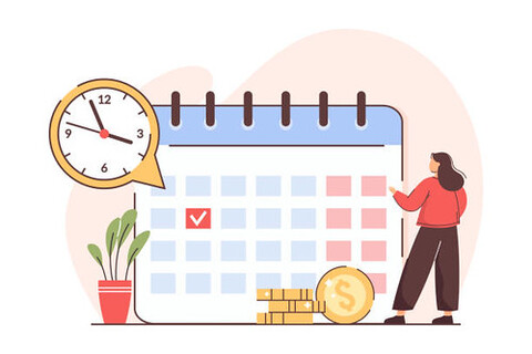 A woman with a red shirt is standing in front of a calendar, which is open to the current date. 